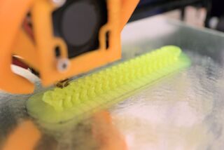 Close-up of a 3D-printer in action